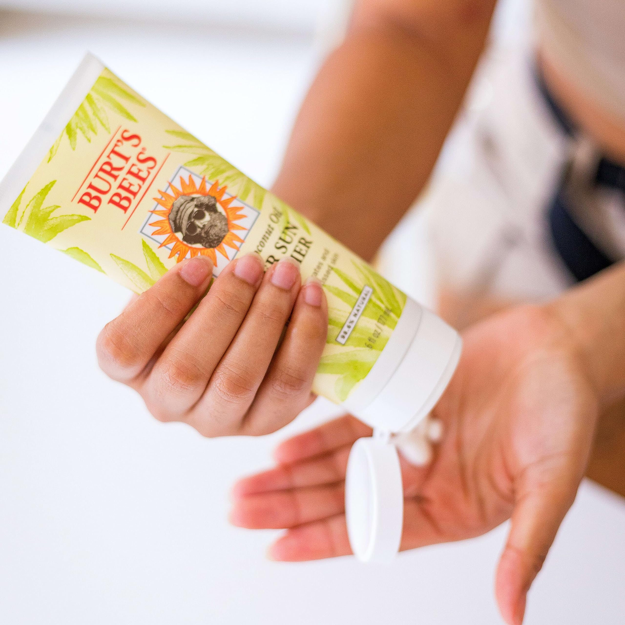 Burt's Bees lotion swatch on skin showing lightweight texture and visible hydration