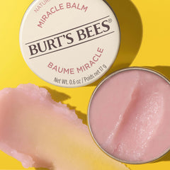 Burt's Bees balm smoothing cuticles to soften and condition nails