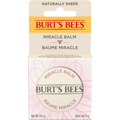 Burt's Bees tin next to a coin showing compact 0.6 oz travel-friendly size
