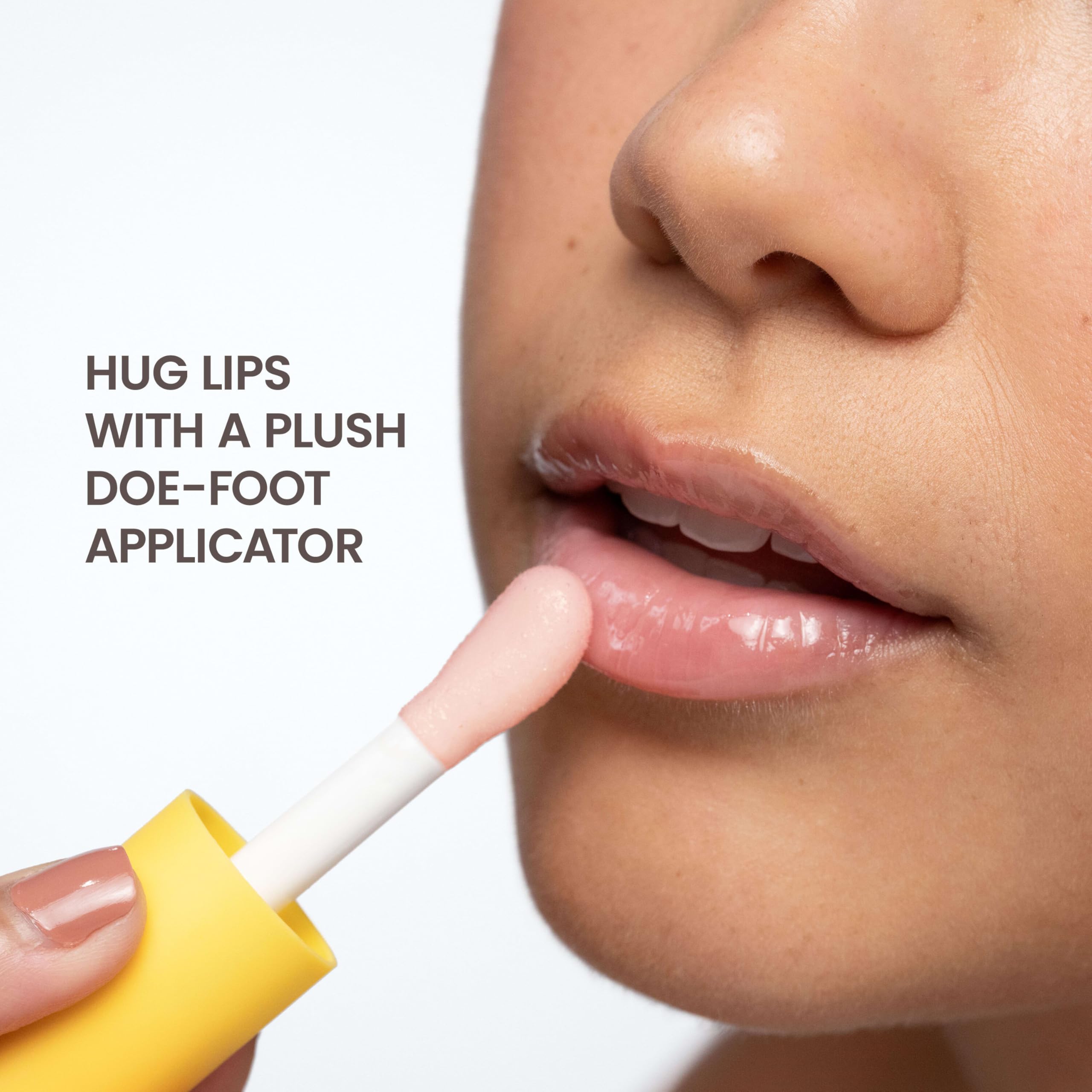 Burt's Bees lip oil in hand for size comparison, portable and travel-friendly convenience
