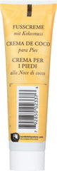 Burt's Bees cream texture on fingertip highlighting rich coconut moisture
