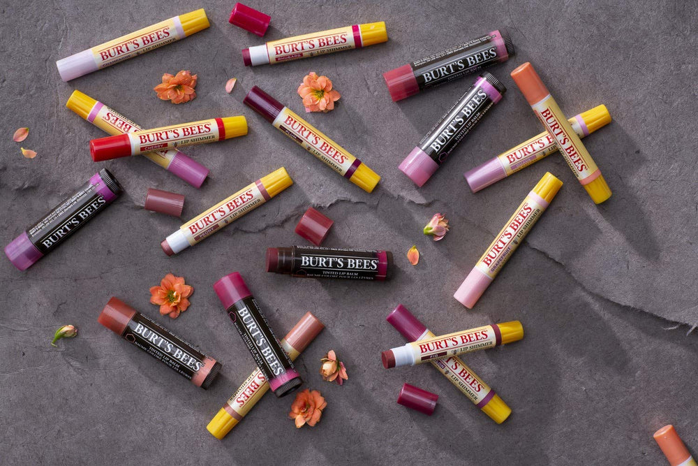 Burt's Bees swatches on skin showing sheer lilac tint and natural shine
