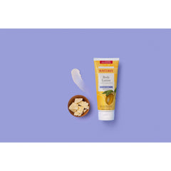 Burt's Bees applied to forearm in lifestyle scene, demonstrates smooth non-greasy feel