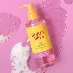Burt's Bees bottle held in hand to show 8 fl oz size and scale