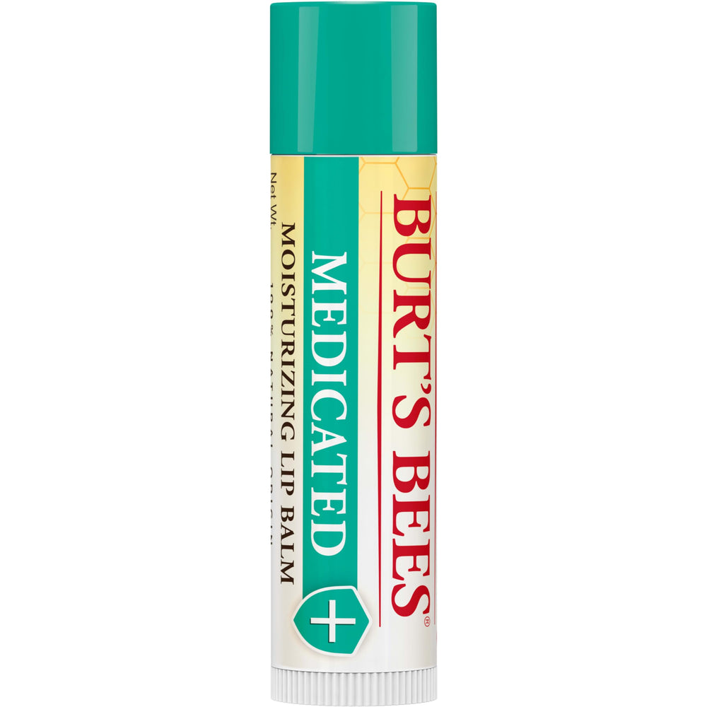 Burt's Bees lip balm in hand demonstrating pocket-ready size and portability