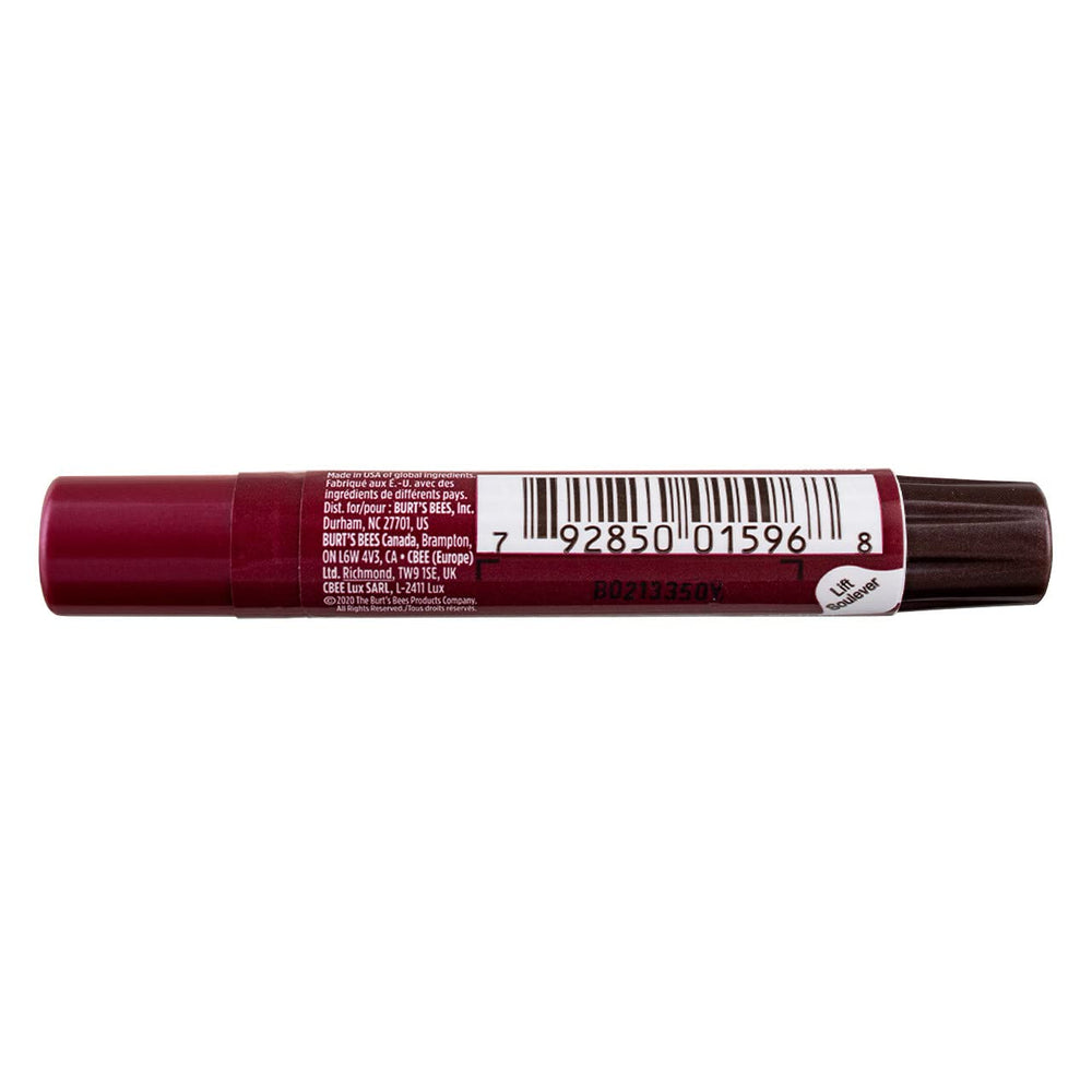 Model applying Burt's Bees Lip Shimmer Plum for glossy plum tint and instant hydration