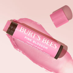 Burt's Bees lip balm used outdoors for quick hydrating touch-ups on the go