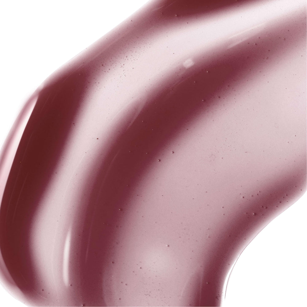Burt's Bees lip swatch closeup showing sheer plum tint and high shine