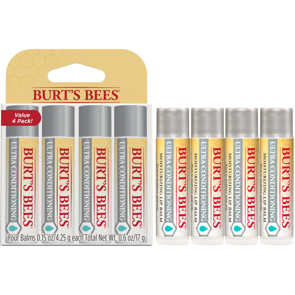 Burt's Bees tube beside coin for scale to illustrate compact travel-ready size