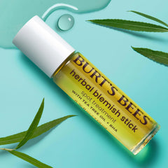 Burt's Bees stick applied to cheek in lifestyle shot showing targeted spot treatment