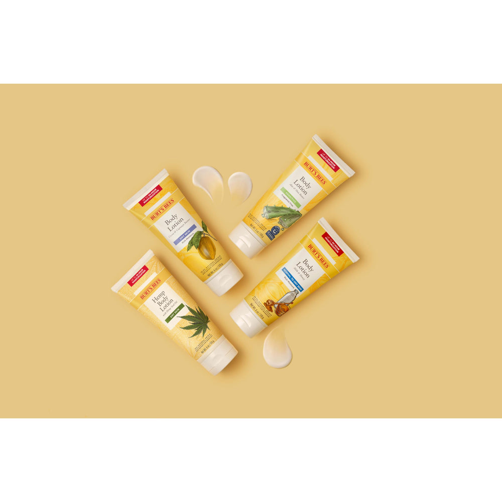Burt's Bees lotion texture dispensed on hand, shows creamy quick-absorbing finish