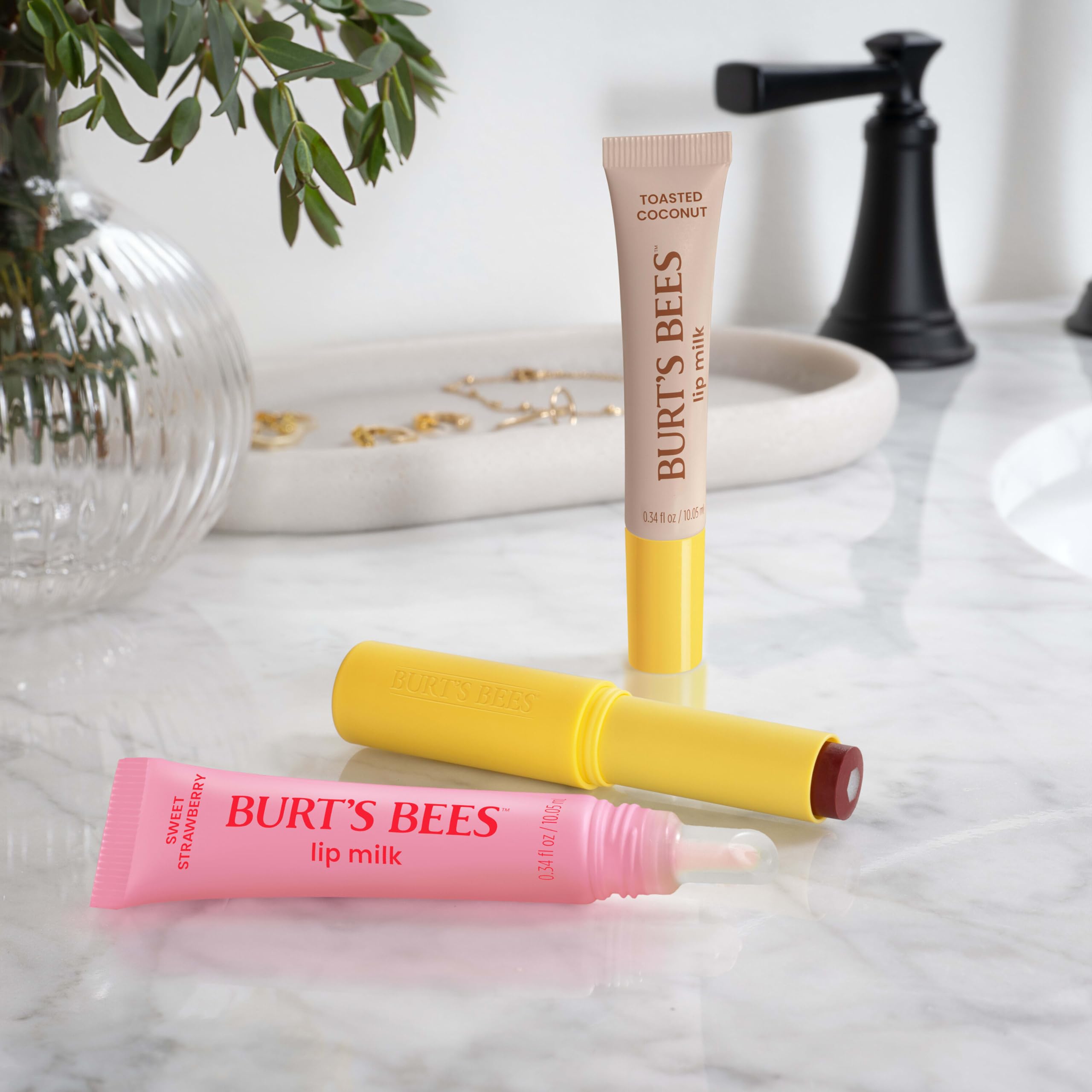 Burt's Bees product beside coconut and almond for toasted coconut scent