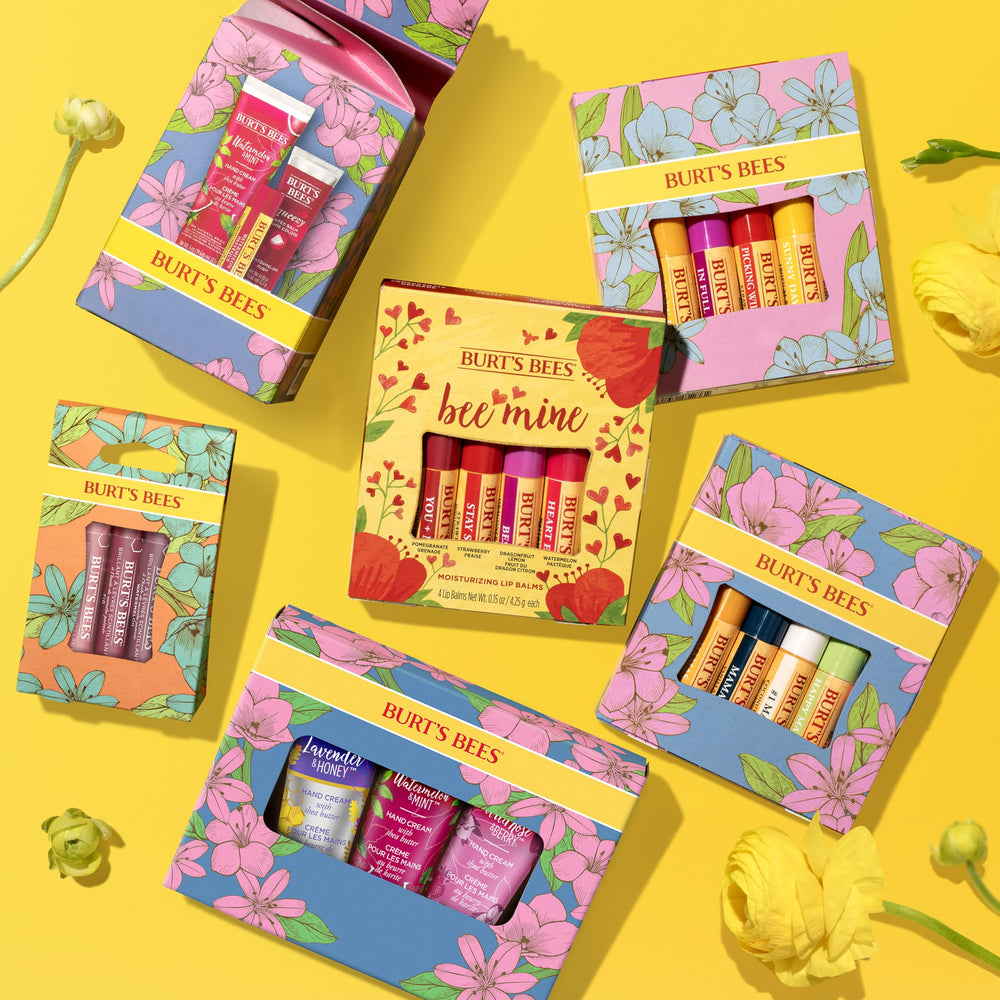 Burt's Bees Tropical Pineapple tube in a beach scene conveying hydrating, tropical scent