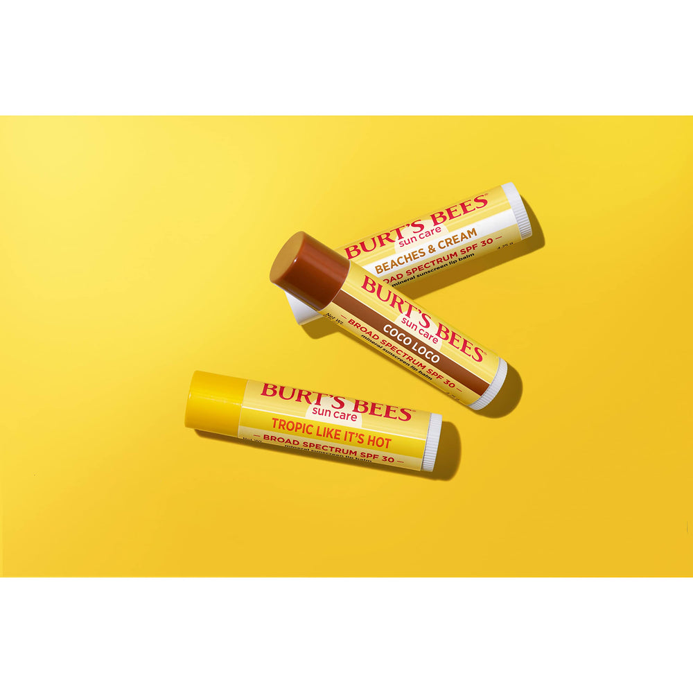 Burt's Bees tubes with caps off showing product solid stick and easy coverage benefit