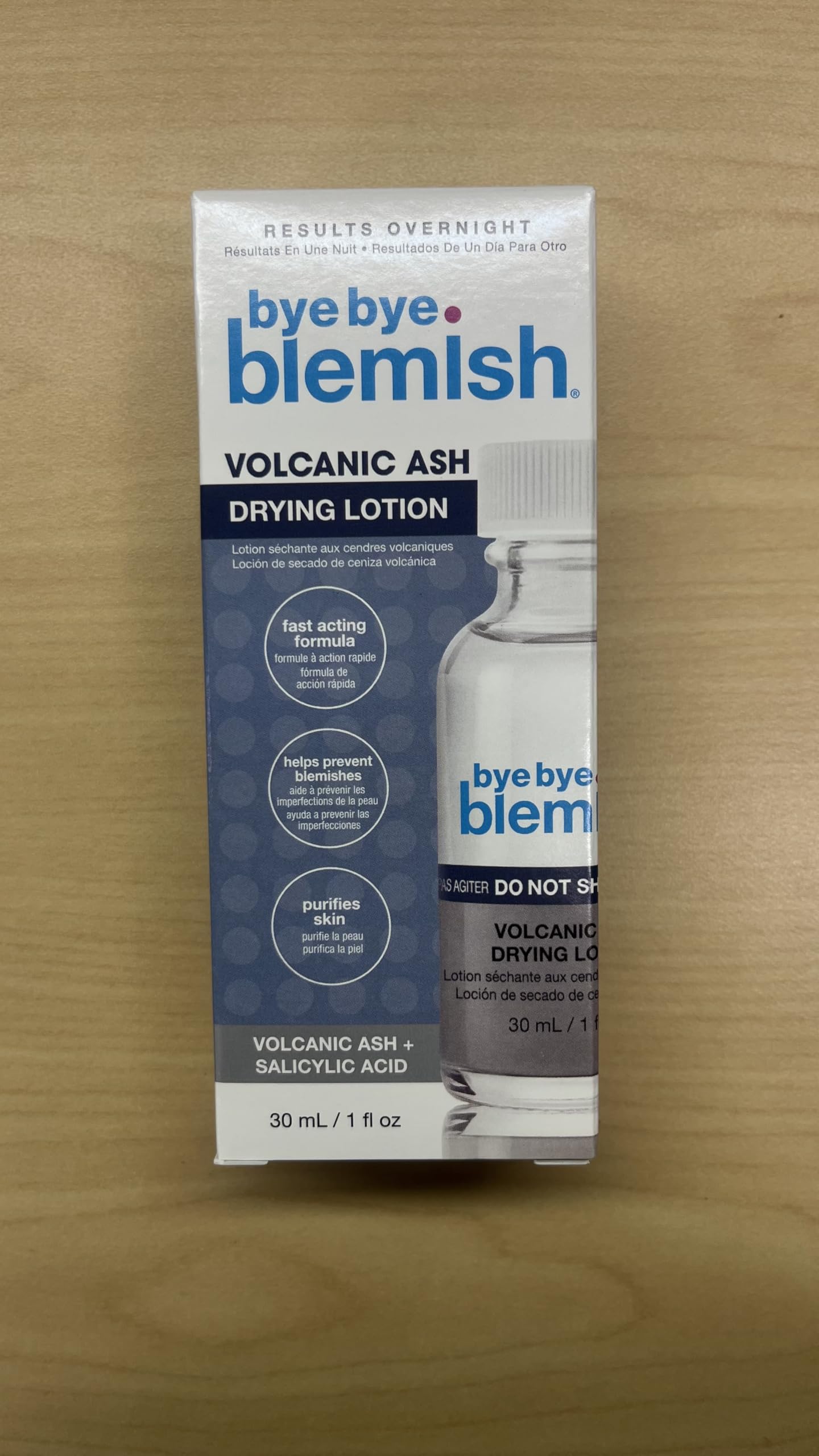 Bye Bye Blemish being applied with a cotton swab to a single blemish for precise overnight treatment benefit