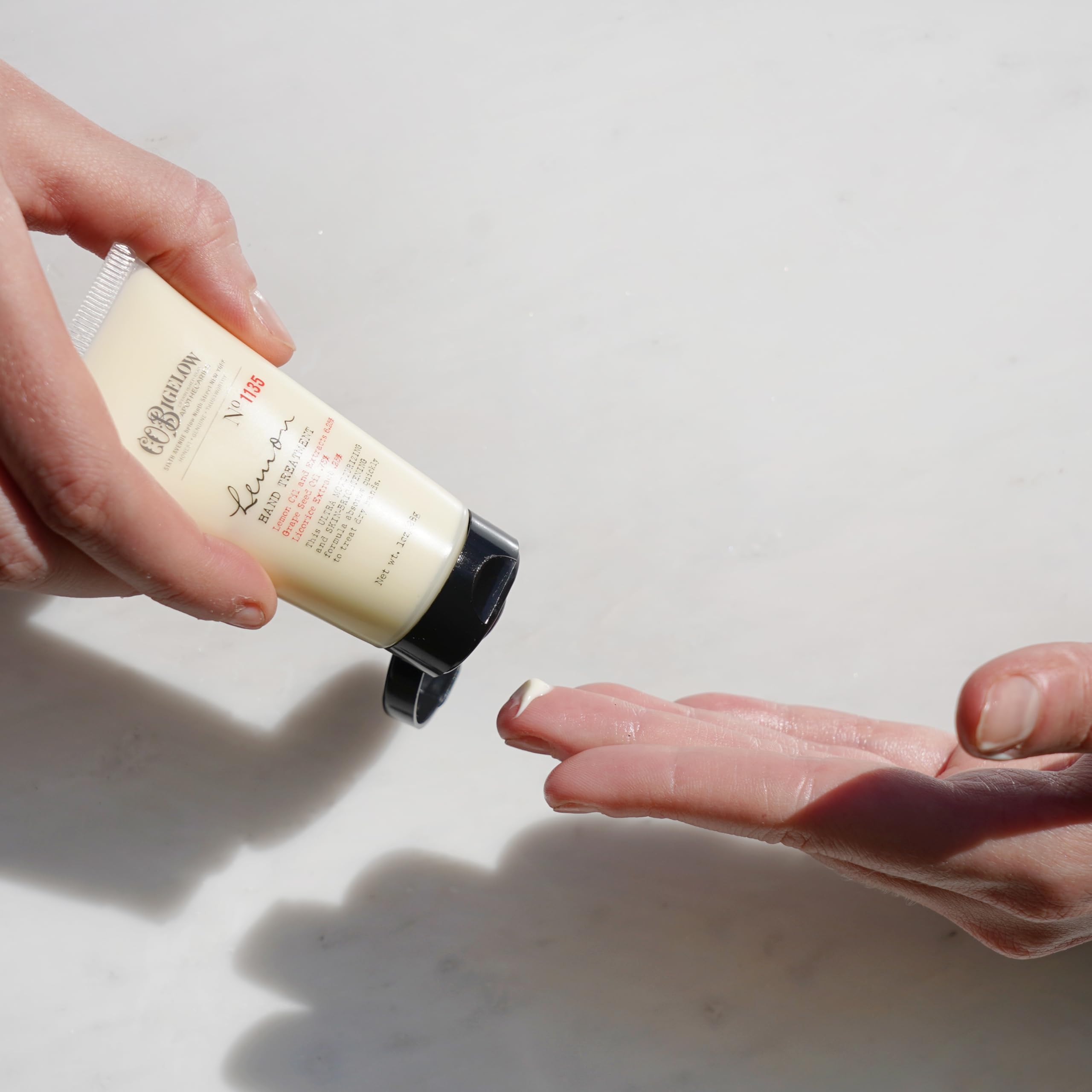 C. O. Bigelow lotion applied to hands demonstrating quick moisturizing and non-greasy feel