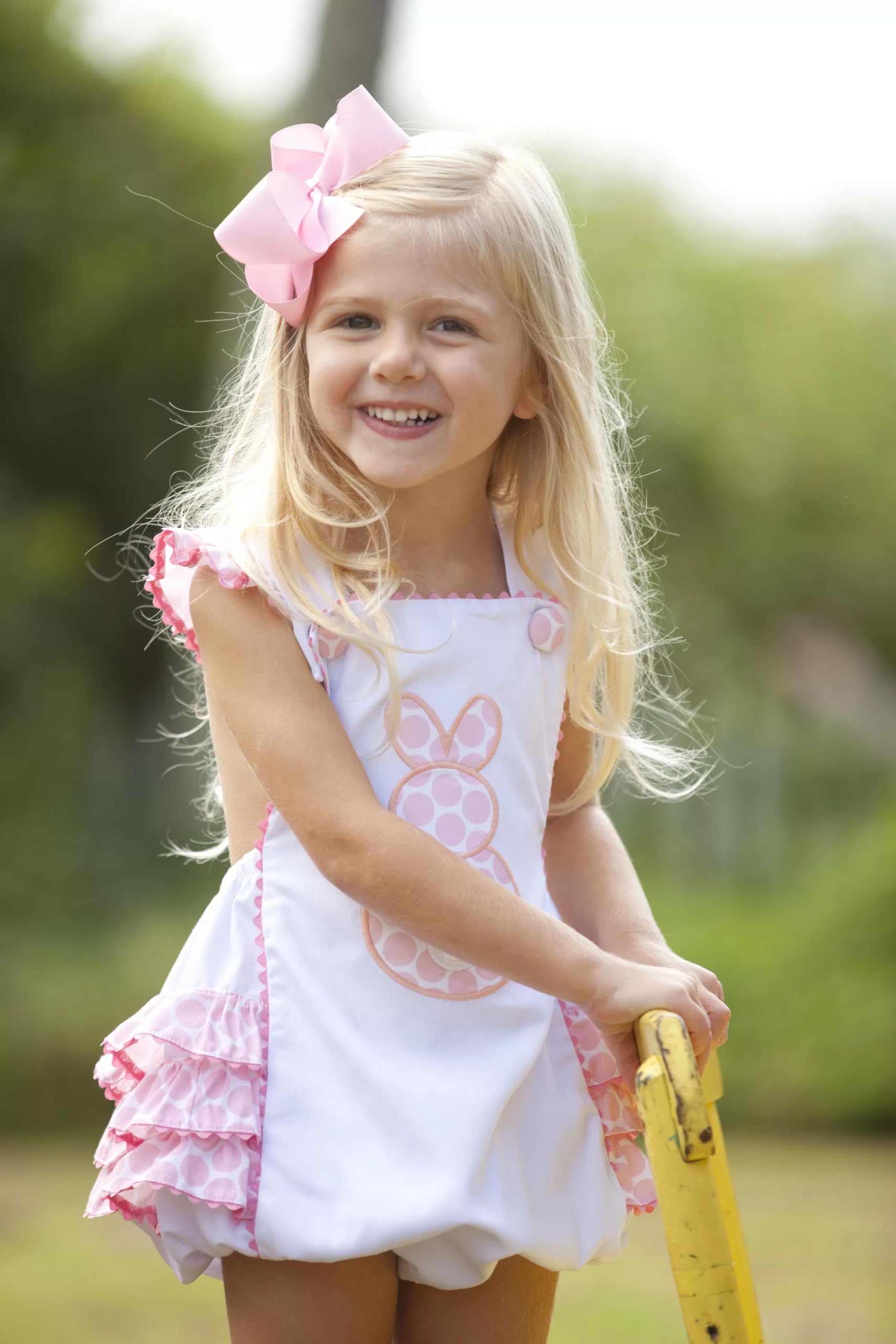 CÉLLOT bow worn on toddler ponytail showing cute styling and stay-put hold