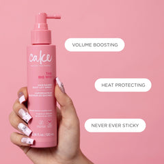 Cake Beauty bottle with lemon cookie props highlighting fragrance