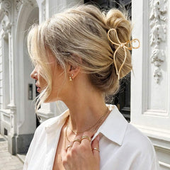 CAKURE bow clip beside ruler showing 4.5 inch size for hair fit
