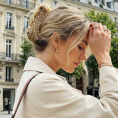 CAKURE clips holding a thick bun to demonstrate strong grip for heavy hair
