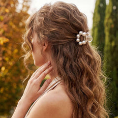 CAKURE side profile of an open clip showing secure spring and gentle hold benefit