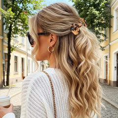 CAKURE styled hair at an event showing decorative bow and refined look