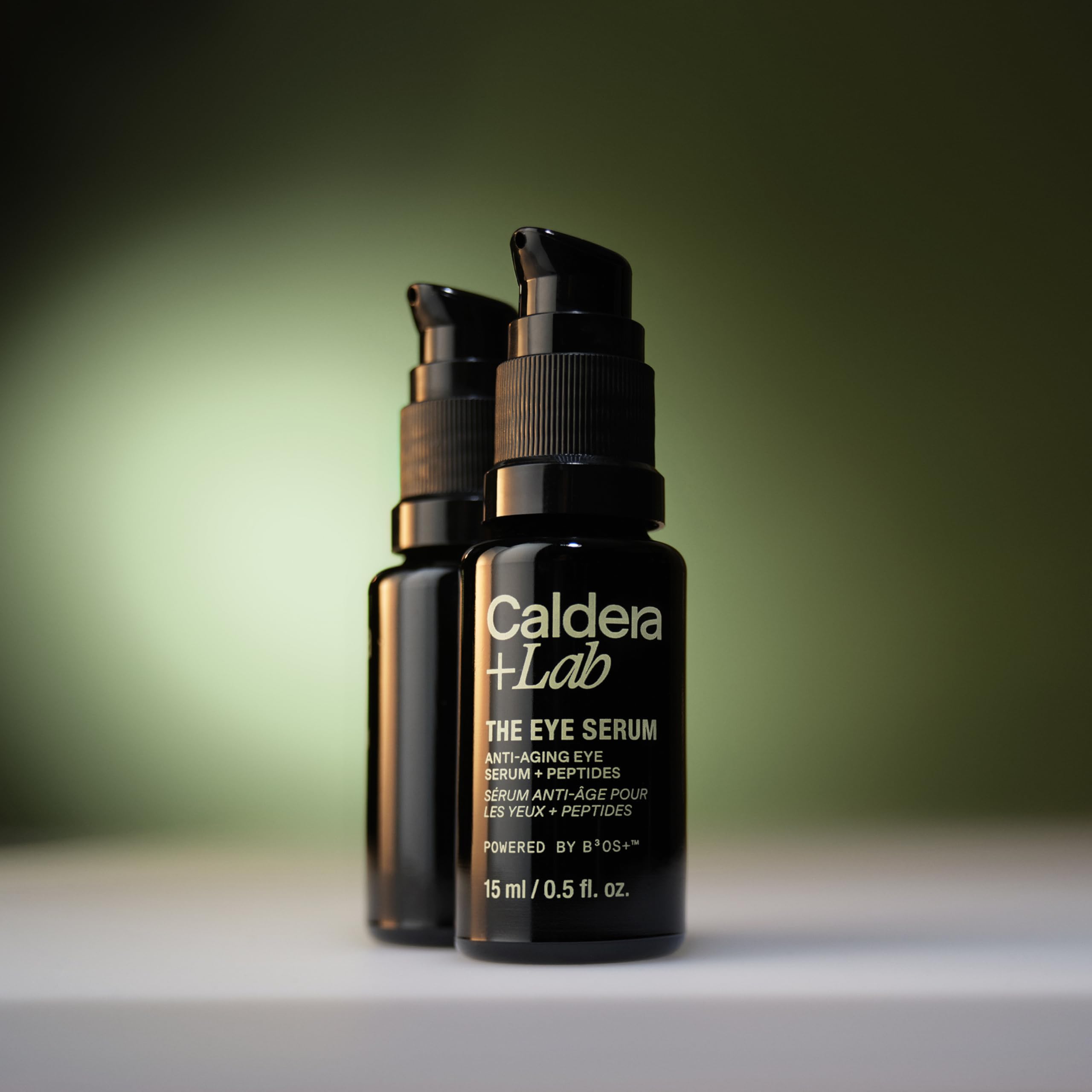 Caldera + Lab bottle next to coin showing compact size for grooming routines