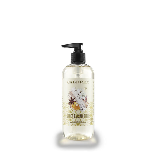 Caldrea front packaging showing bottle and warm balsam fragrance benefit