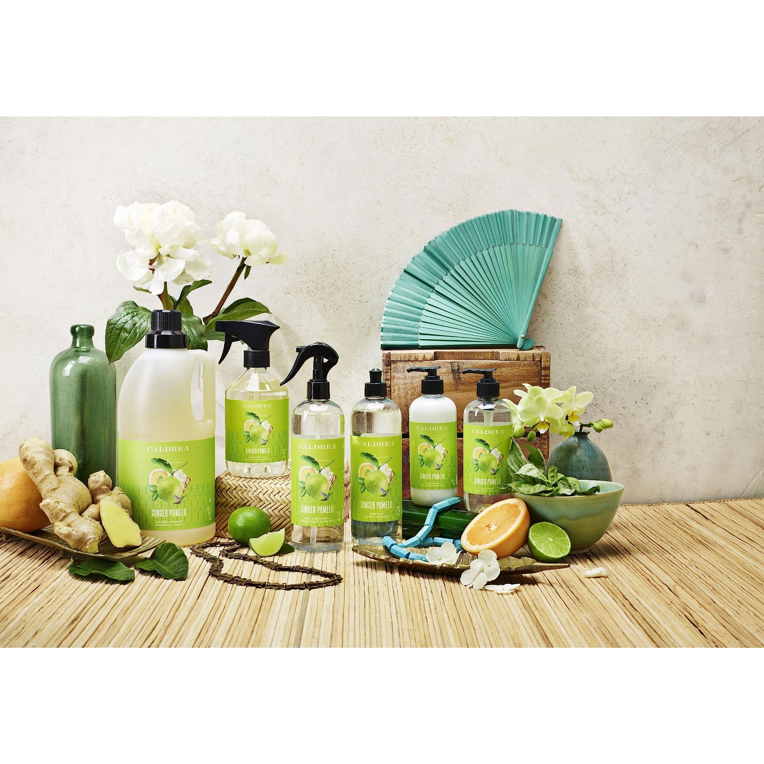 Caldrea bottle next to everyday items showing 10.8 oz scale and countertop fit