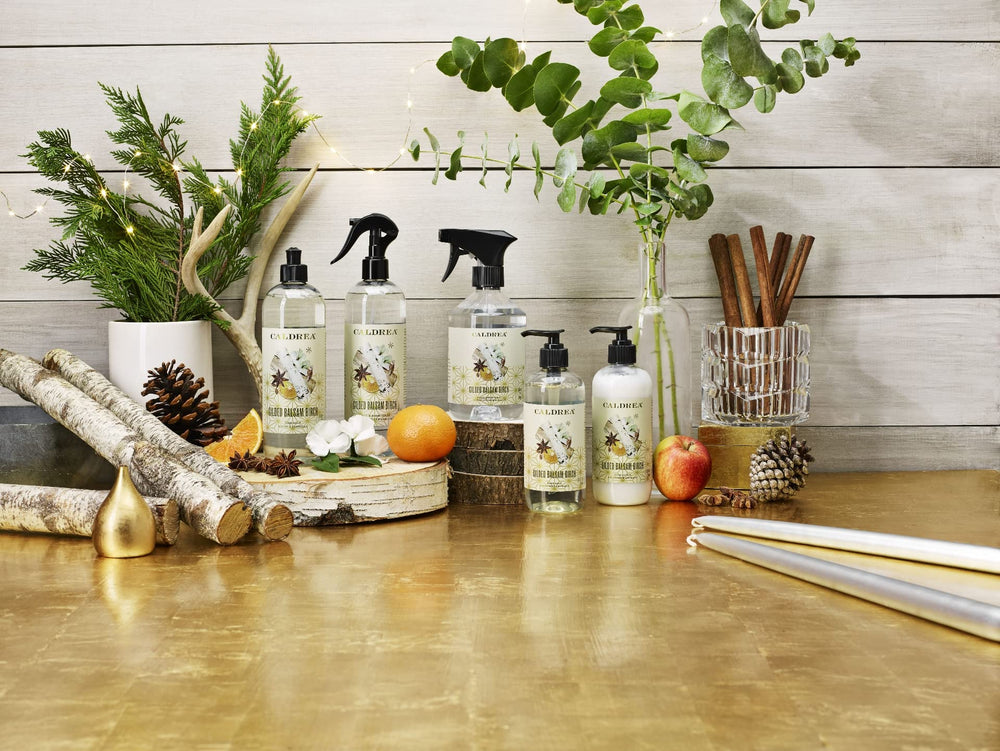Caldrea bottle styled in bathroom conveying cozy seasonal atmosphere