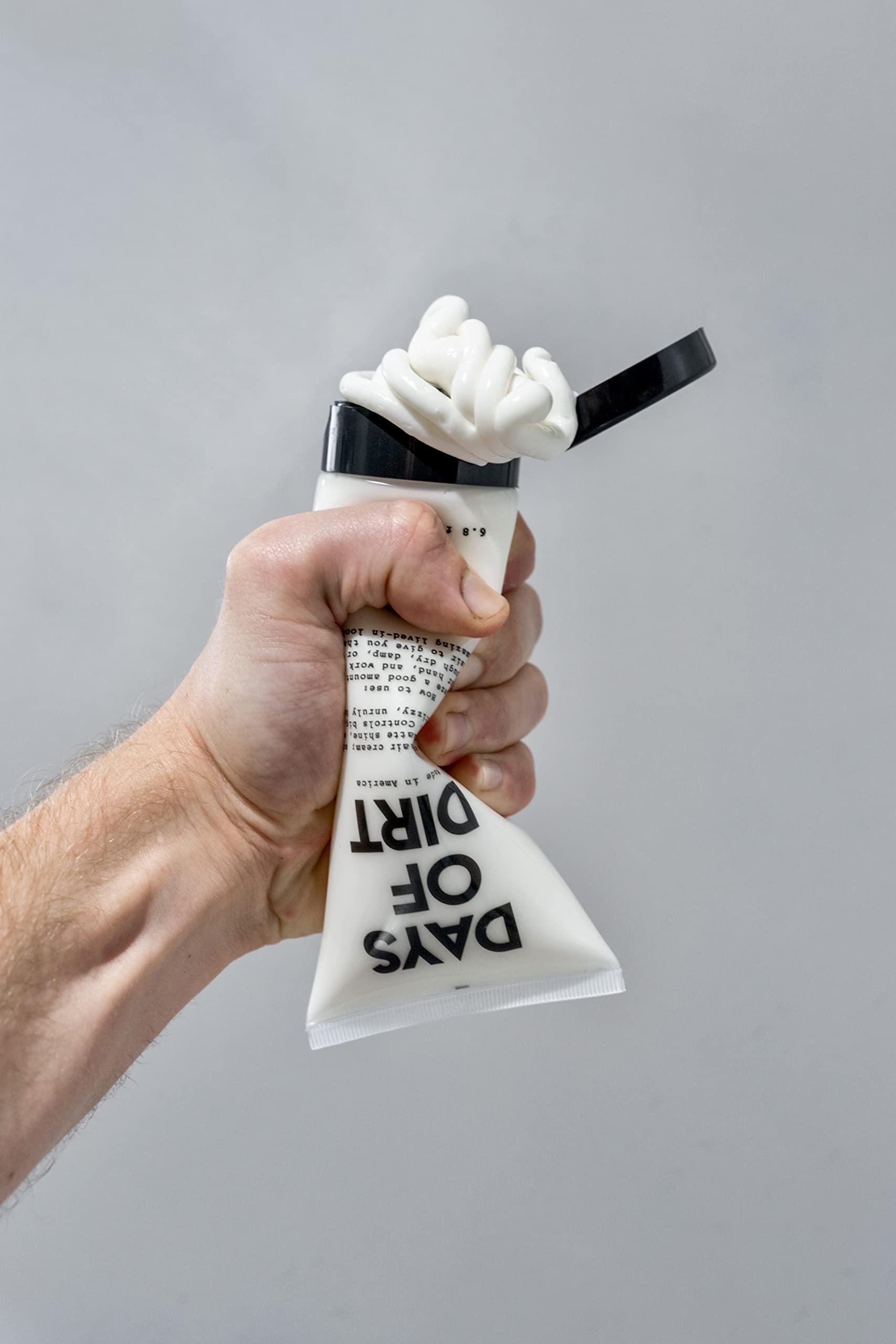California Born tube on bathroom shelf conveying travel-friendly, everyday use