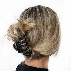 Camila Paris clip held in hand showing 3.5-inch scale and ease