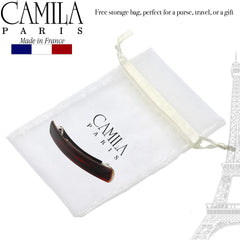 Camila Paris size comparison next to coin showing 4-inch scale