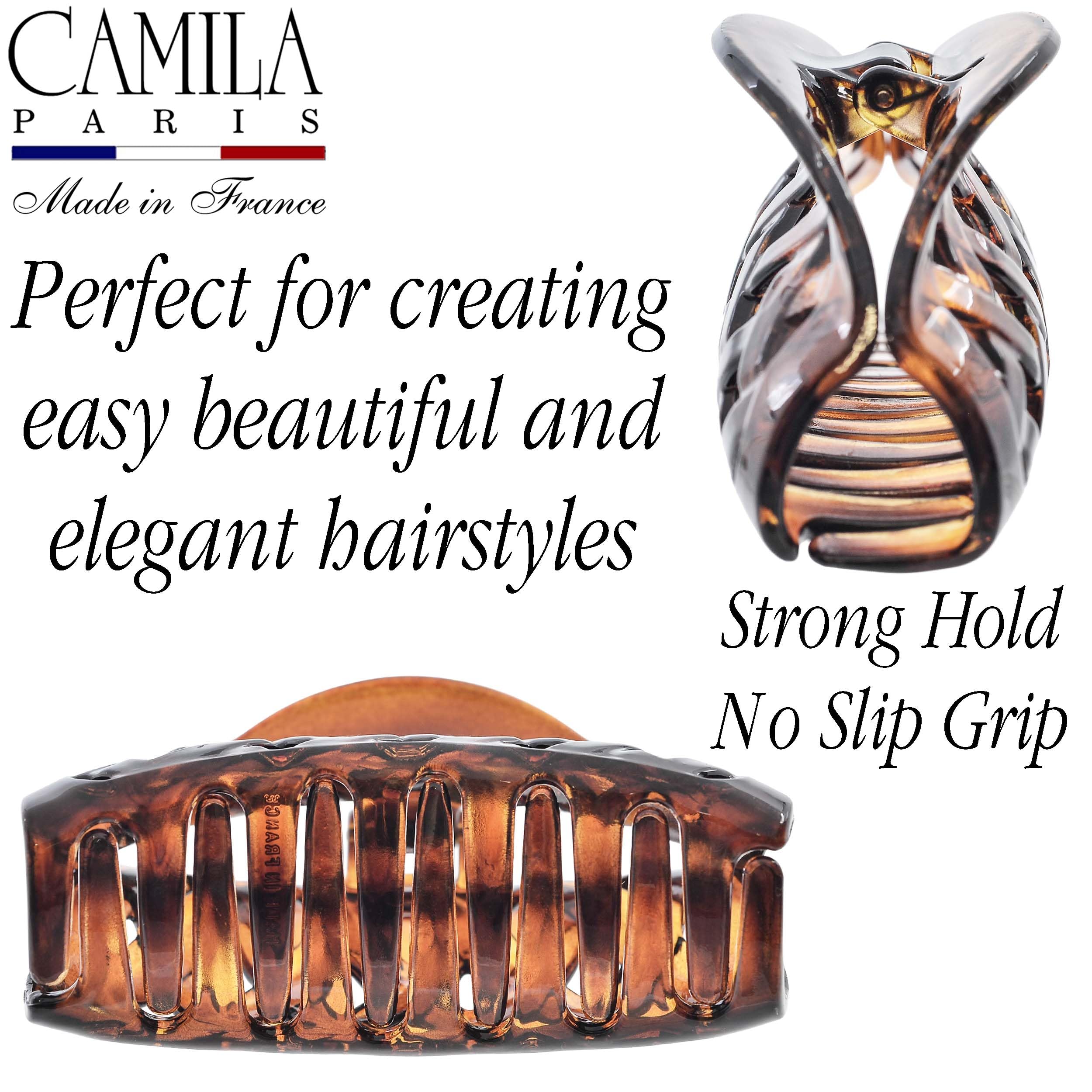 Camila Paris held in hand for scale showing generous size for heavy hair
