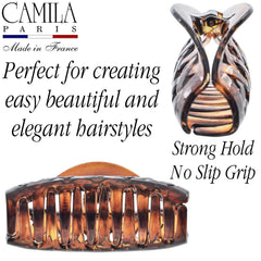 Camila Paris held in hand for scale showing generous size for heavy hair