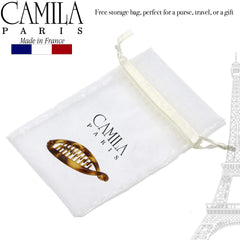 Camila Paris holding a half-up hairstyle adding tidy polished look