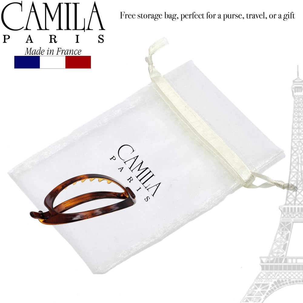 Camila Paris used to secure a low bun illustrating strong hold for formal looks