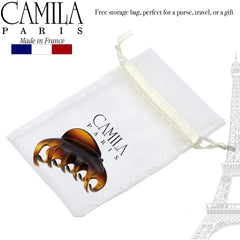 Camila Paris clip in hand showing 3.5-inch scale and portability benefit