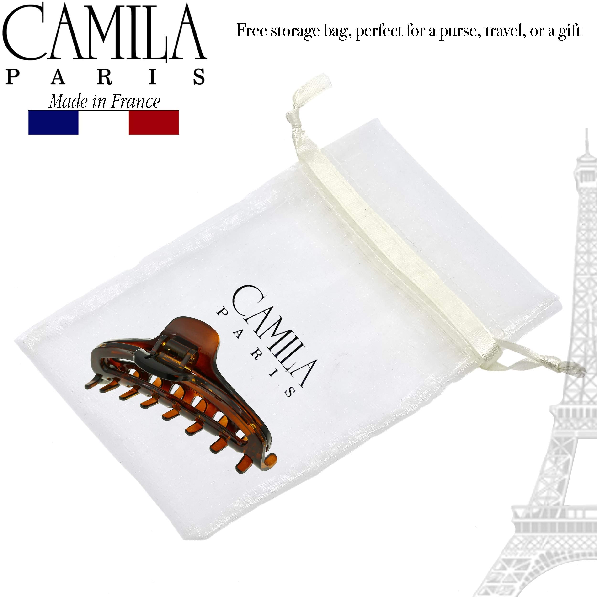 Camila Paris beside ruler for scale showing compact size and easy portability