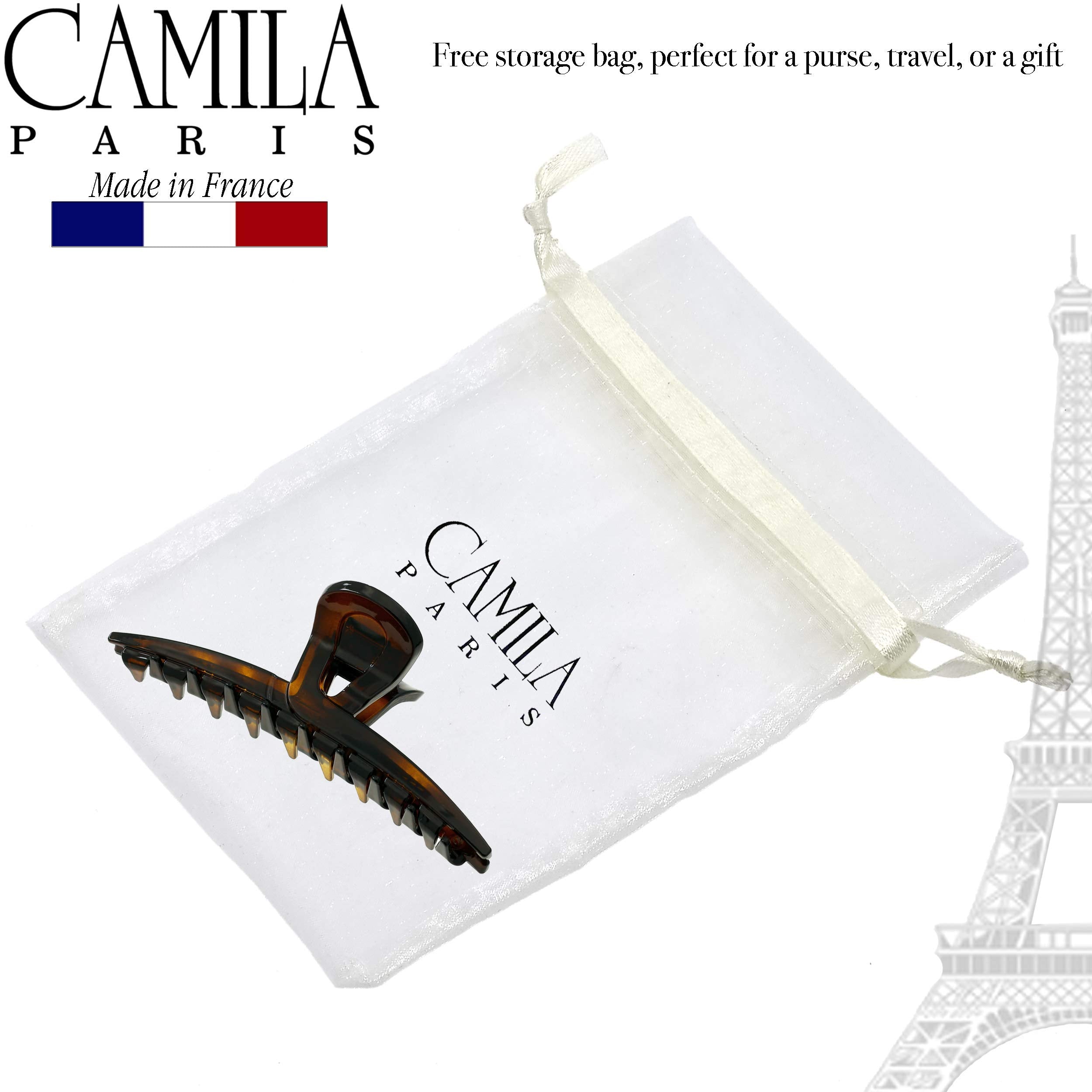 Camila Paris CP2371 placed next to a hand for size comparison and easy portability
