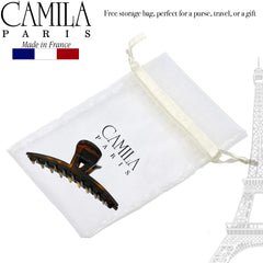 Camila Paris CP2371 placed next to a hand for size comparison and easy portability