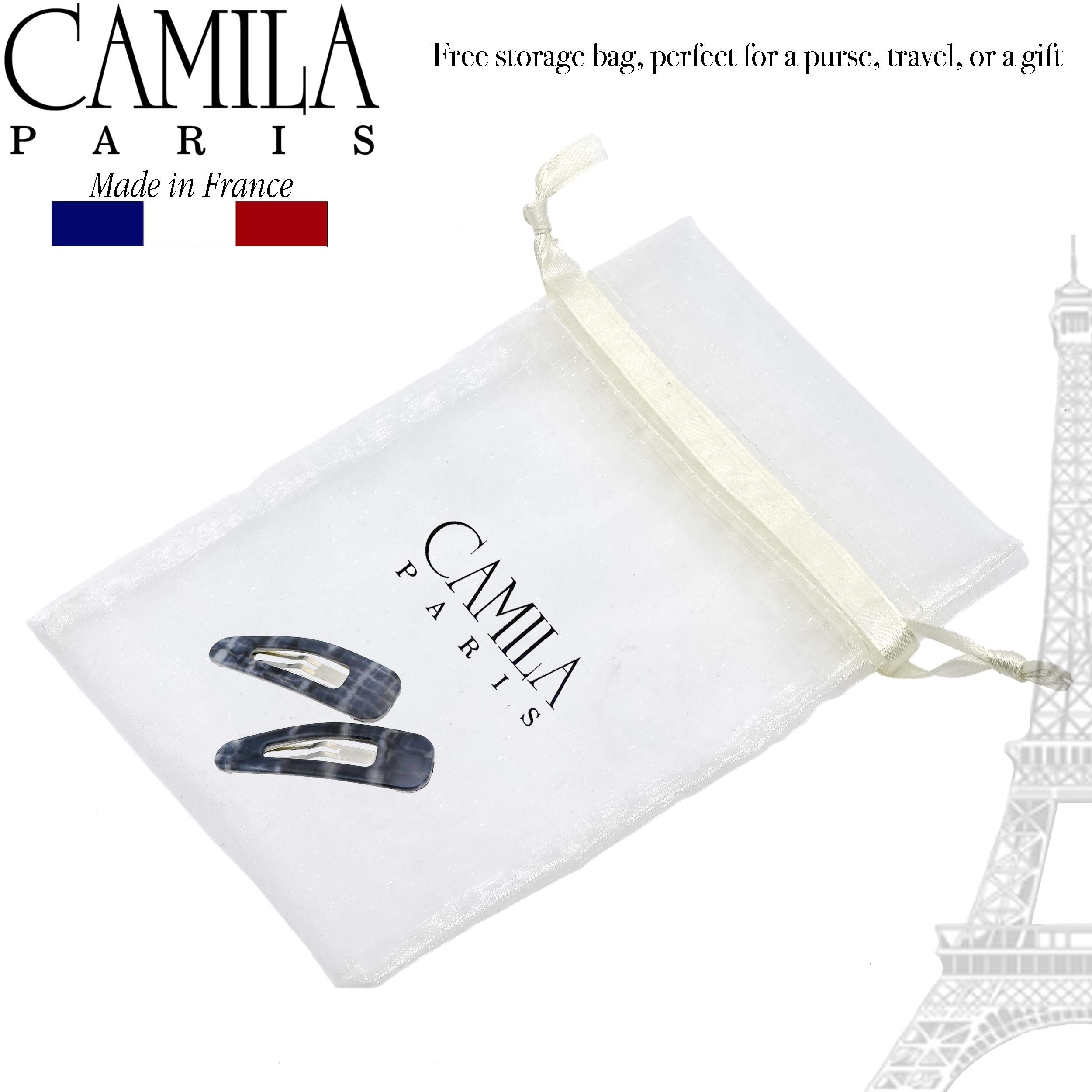 Camila Paris paired clips used in a half-up hairstyle for elegant look