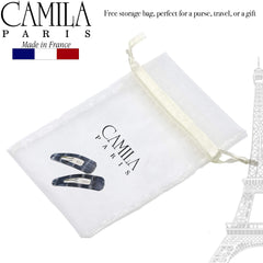 Camila Paris paired clips used in a half-up hairstyle for elegant look
