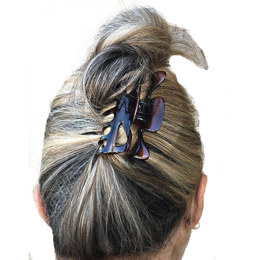 Camila Paris side profile highlighting clip curve and comfortable grip benefit
