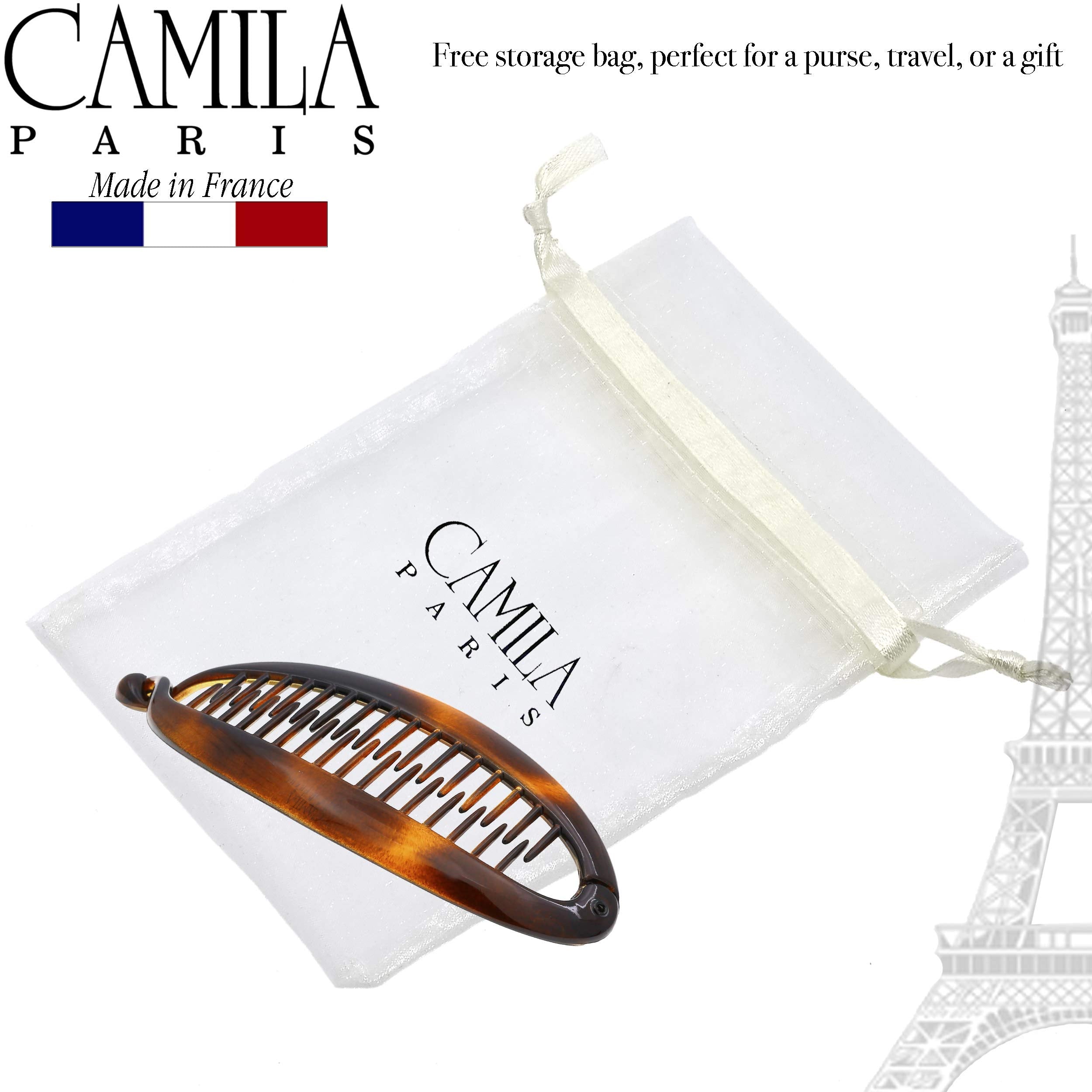 Camila secured in a French twist hairstyle for a polished updo