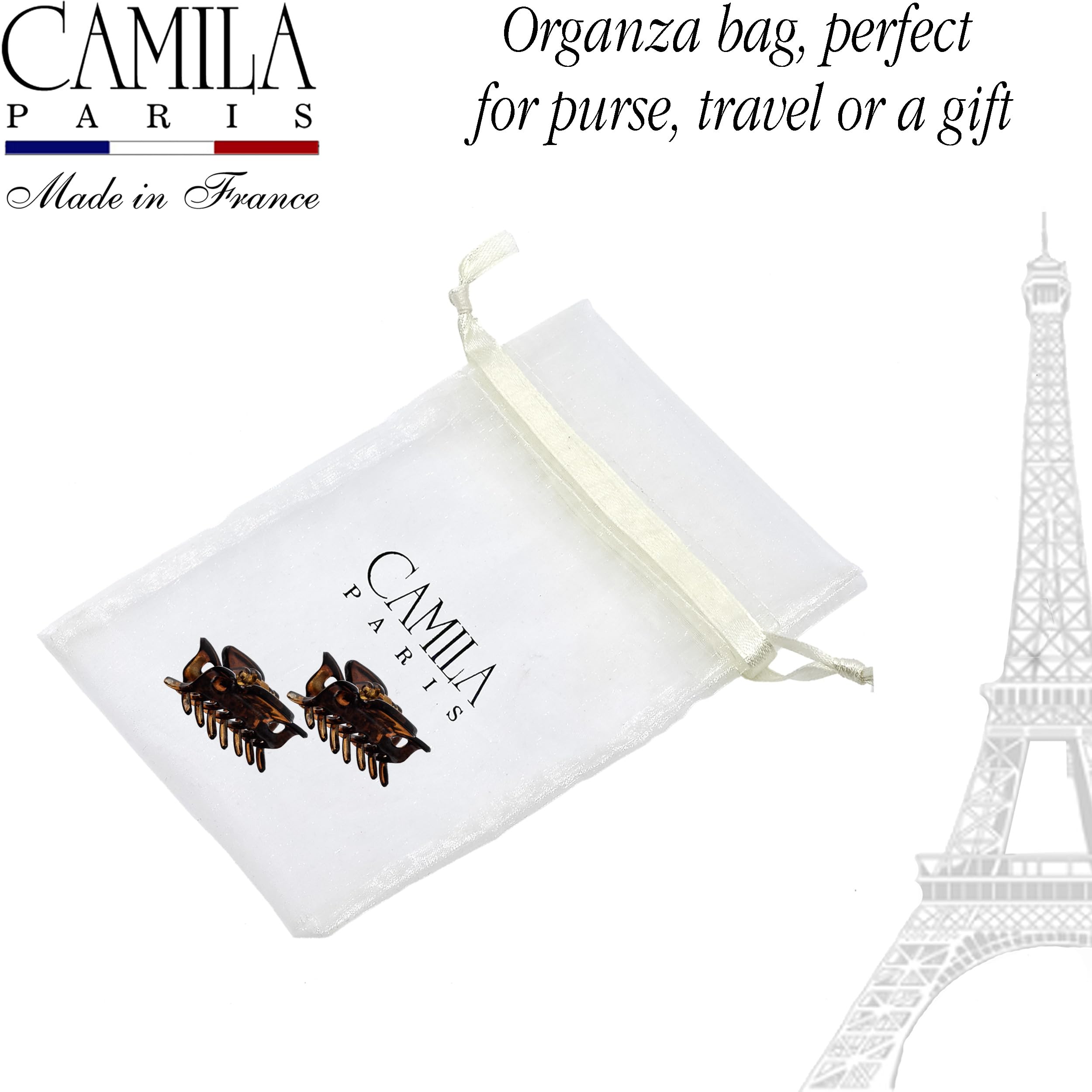 Camila Paris clips held between fingers to show compact 1.5 inch scale benefit