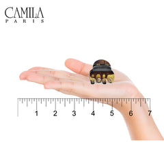 Camila Paris spring mechanism detail showing strong clamp tension for secure hold benefit