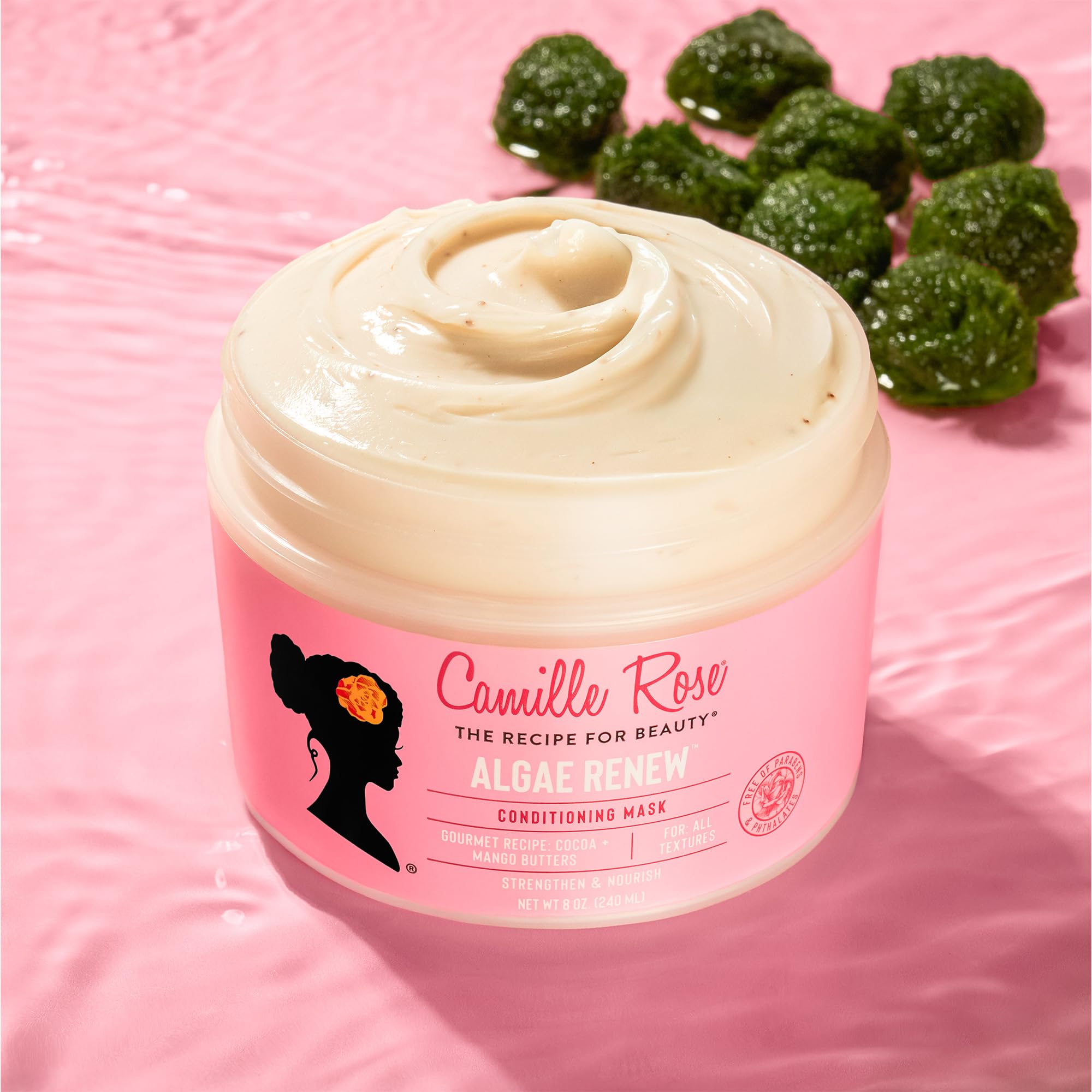 Camille Rose applying mask to textured hair demonstrating improved detangling