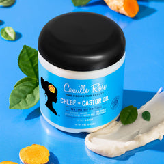 Camille Rose butter on hands demonstrating spreadability and detangling benefit