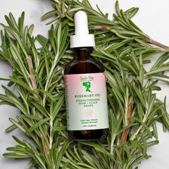 Camille Rose smoothing oil through hair lengths to reduce frizz and breakage